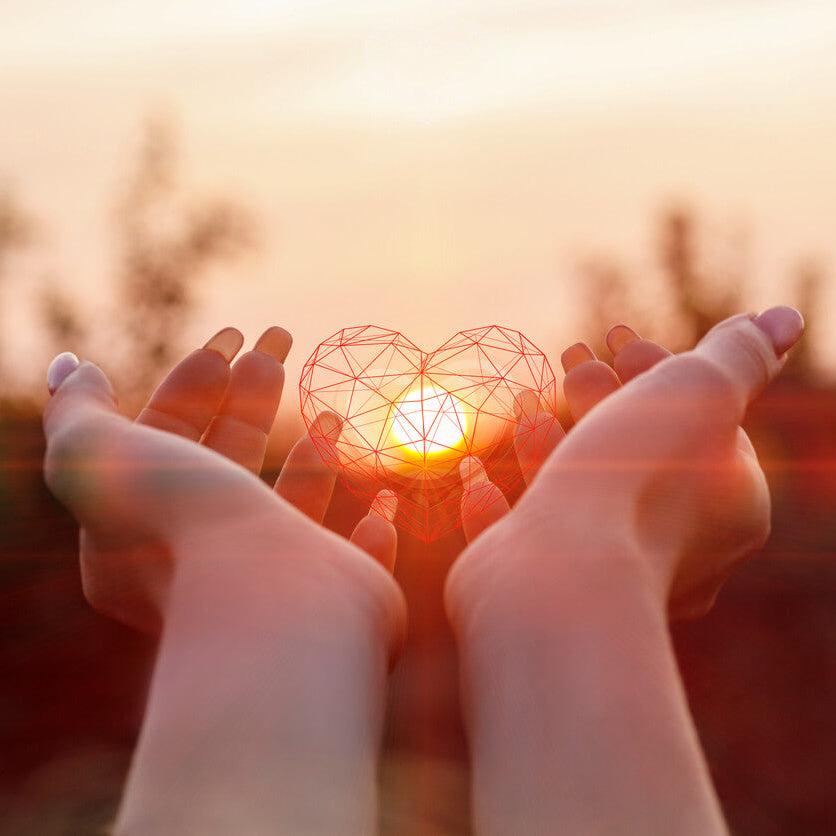 Hands holding lighted heart for mission page