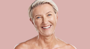 Woman with a happy expression on a pink background